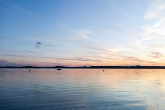 Lake water reflecting sky - Powered by Adobe