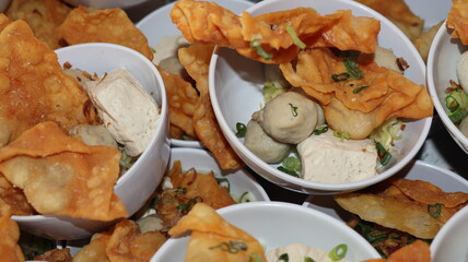 Bakso Malang, meatball soup from Malang, East Java served with noodles, tofu, and fried pangsit or...