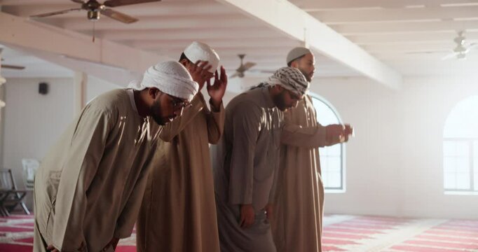 Man, islam and praying with salah at mosque in jamaah for holy gathering, spiritual faith or worship. Muslim men, friends or group in takbir, glorifying god or allah for religious belief together
