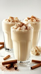 Creamy Iced Beverages Topped with Cinnamon and Ice Cubes