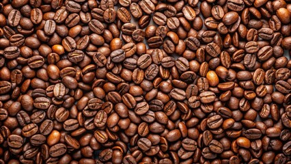 Fototapeta premium Top view of roasted coffee beans forming a textured background, coffee, grain, beans, texture, background, top view