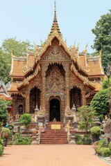Ornate Golden Temple Entrance with Carved Details and Stairs