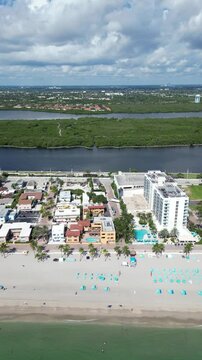 Flying along the coastline of Hollywood Beach on Florida's east coast, located in Broward County between Fort Lauderdale and Miami.
