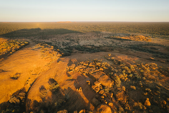 Aerial of Walgahna Walga Rock at sunset near Cue Western Australia