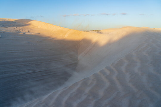 Detailed view of ripples and patterns on the side of sand dunes