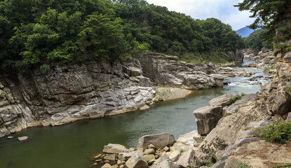 High angle and summer view of rocks and cliffs at the canyon of Sundam Valley on Hantan River near Cheorwon-gun, South Korea