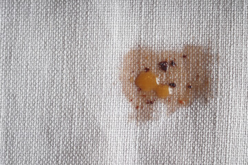 Fabric that is stained with an abstract pattern created by a food spill, showcasing art