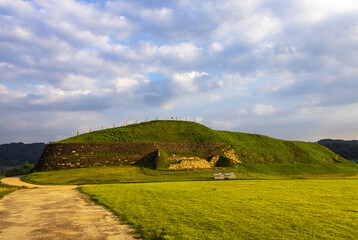 Yeoncheon-gun, Gyeonggi-do, South Korea - July 26, 2021: Summer and morning view of trail and lawn with fortress wall at Yeoncheon Horogoru