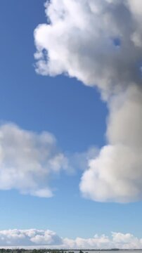 Side shot of a windmill and nuclear power plant in Doel. Belgium