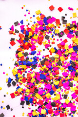 flying gold red colorful confetti isolated on white background