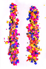 flying gold red colorful confetti isolated on white background