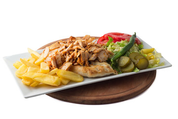 Turkish cuisine. Doner kebab meat with pommes frites potatoes and salad on plate isolated on white background