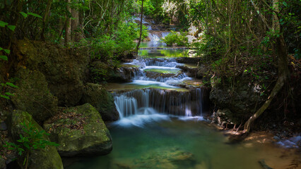 Obraz premium Deep forest waterfall in Thailand. Erawan waterfall National Park Kanjanaburi Thailand.