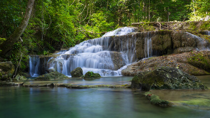 Naklejka premium Deep forest waterfall in Thailand. Erawan waterfall National Park Kanjanaburi Thailand.