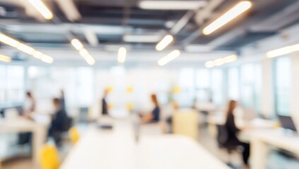 Obraz premium Blurred office interior with people working, featuring a modern white and light blue color scheme with yellow accents. Ideal for a business concept banner, with soft lighting and a clean, contemporary
