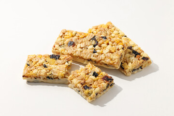 Delicious granola bars on a white background