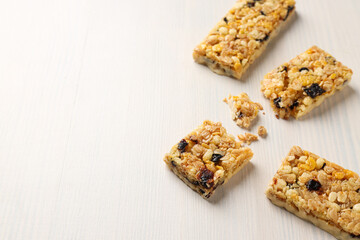 Delicious granola bars on a white background