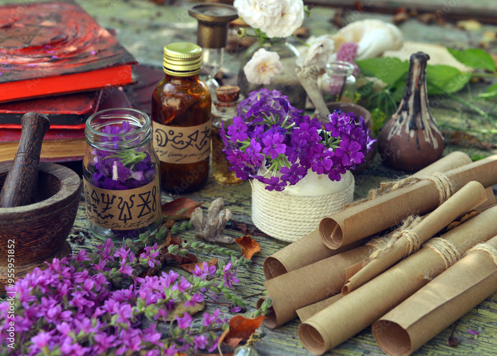 Wall mural Mystic still life with magic book of spells, old paper scrolls and witchy ritual objects on old table. Occult, esoteric, wicca and divination concept. No foreign language, all symbols are fictional