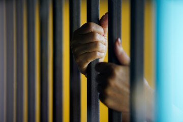 Obraz premium hands in jail