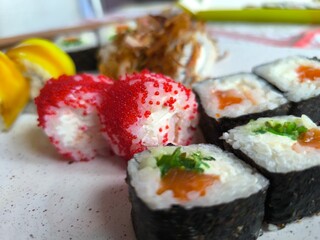 selection of fresh sushi on a white plate.High quality photo