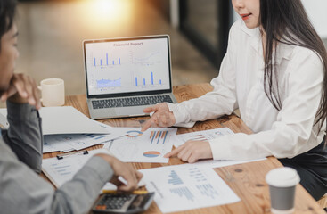 Technology and financial advisory services concept. Business teamwork and working on digital laptop computer with advisor showing plan of investment to clients at table office. Digital marketing.