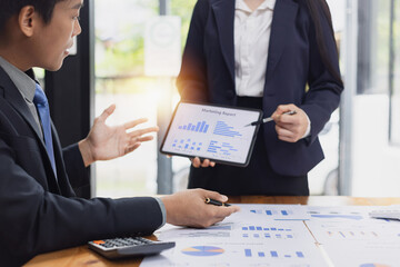 Business financial advisory services concept. Business teamwork and working on digital laptop computer with advisor showing plan of investment to clients at table office. Digital marketing.
