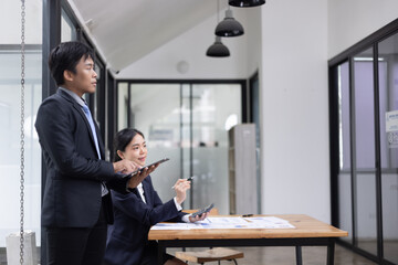Team of businesswoman working together with analysis report chart in office.
