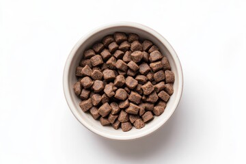 Fototapeta premium A bowl filled with small, brown, kibble-like food pieces, likely for pets.
