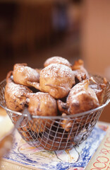 Freshly fried oliebollen a form of fried dough with a dusting of icing sugar