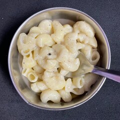 Macaroni in White Sauce in a Steel Bowl