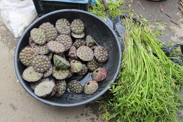 water lily fruits, lotus seeds at market for sale 