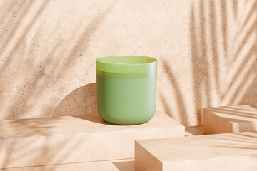 Set of scented candle on beige concrete background decorated with bamboo plant
