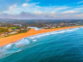 Fototapeta premium Aerial views of sunrise by the sea with clouds