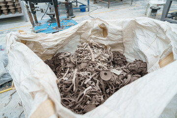 Rows or stacks of Gray unused clay pile for making ceramics, High strength electric insulator...