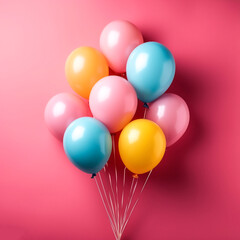 Bunch of bright balloons isolated on pink background