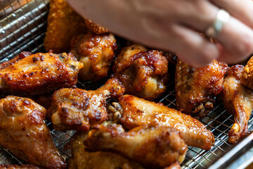 freshly cooked spicy chicken wings on a tray