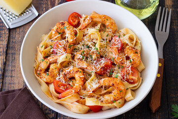 Pasta with shrimps, tomatoes and cheese. Healthy eating. Italian food.