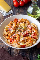 Pasta with shrimps, tomatoes and cheese. Healthy eating. Italian food.