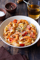 Pasta with shrimps, tomatoes and cheese. Healthy eating. Italian food.