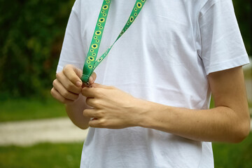 Sunflower lanyard, symbol of people with invisible or hidden disabilities.