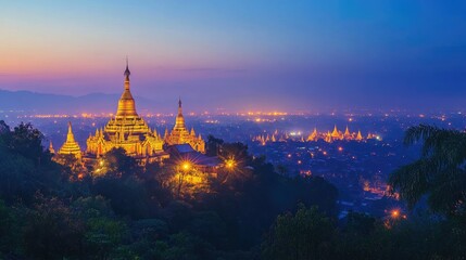 Obraz premium Twilight view of Mandalay Hill, with the golden stupas glowing against the fading light, Mandalay, Myanmar