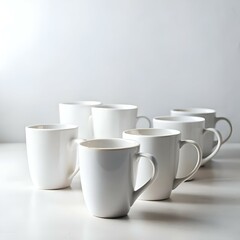 Obraz premium A row of six pristine white mugs sits on a light grey background. creating a simple yet elegant composition.