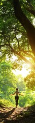 Fototapeta premium A serene moment of tranquility as a person enjoys nature amidst lush greenery and soft sunlight streaming through the trees.