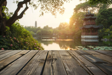 An empty wooden table top with a blurred background for product display, featuring an Asian landscape and pond in a park, sunlight, trees, and a pagoda.