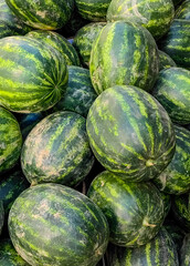 Juicy Watermelons at the Local Market: Organic Summertime Refreshment. Fruit Ninja, concept.