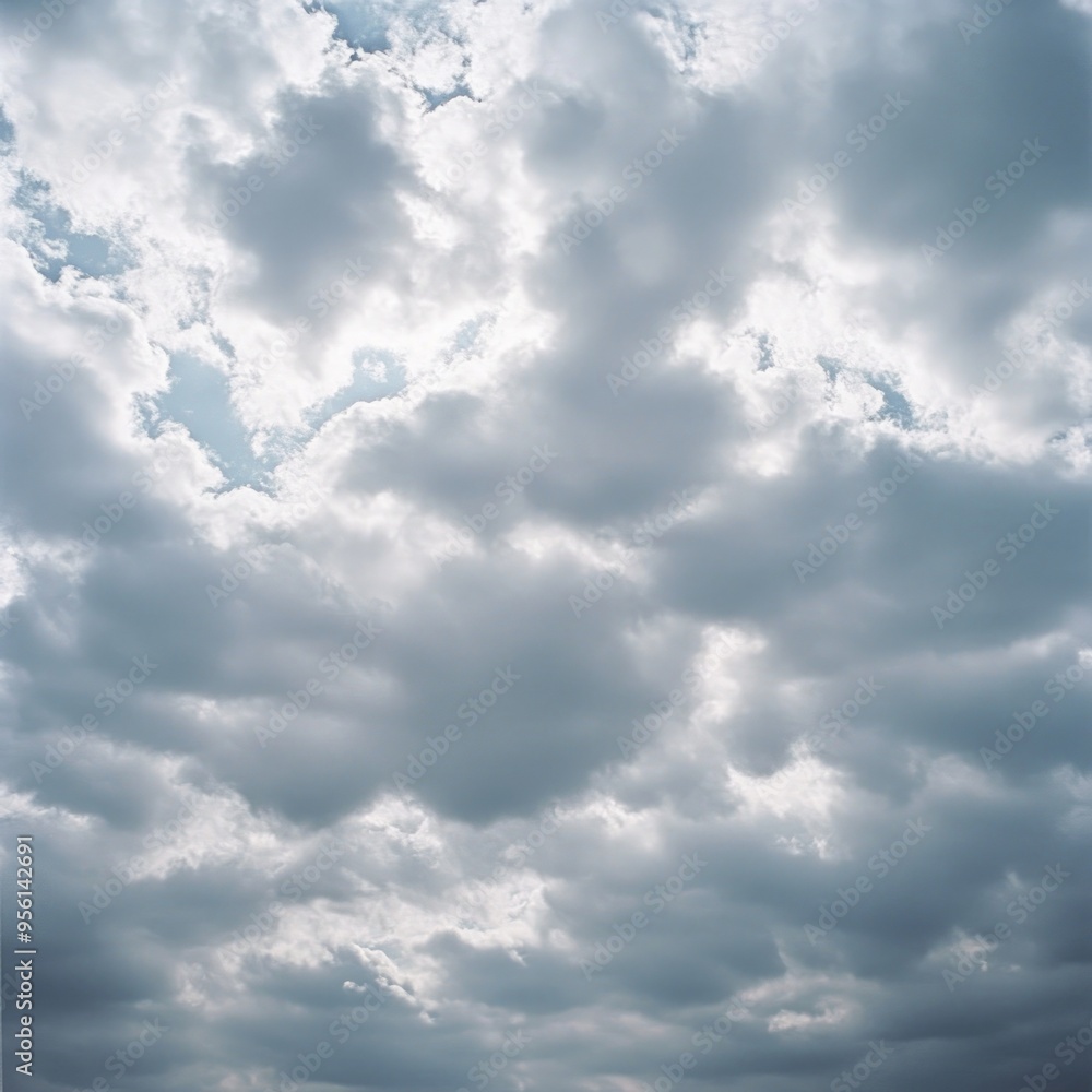 Canvas Prints A cloudy sky with patches of sunlight peeking through.