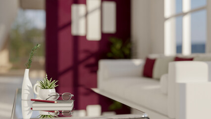 A close-up image of a modern mirror glass coffee table in a modern red living room. home interior