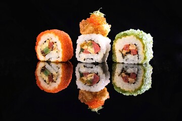Sushi rolls on dark background. The art of Japanese cuisine
