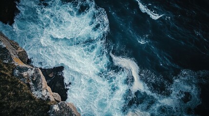 Fototapeta premium Aerial perspective of a calm, deep blue ocean with gentle waves and an empty horizon for text.