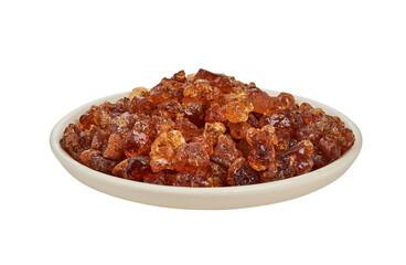 acacia gum or gam arabic isolated on white background in plate